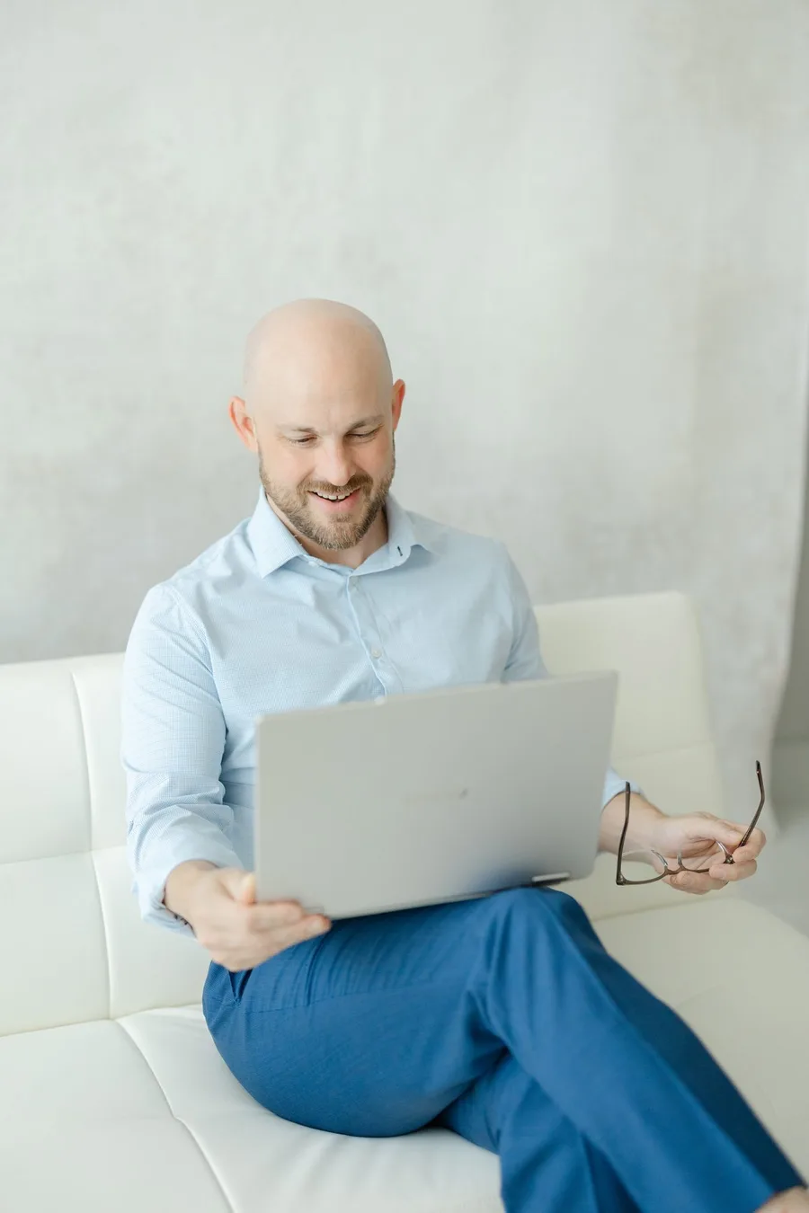 Logan Williamson reviewing an episode script on a laptop